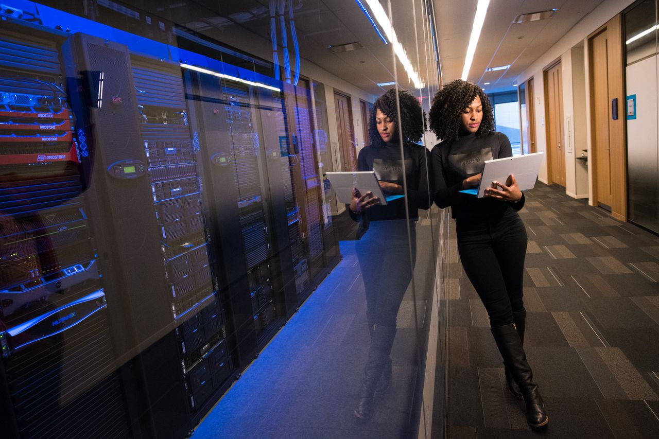 IT team checking servers in a technical room during a disaster recovery exercise
